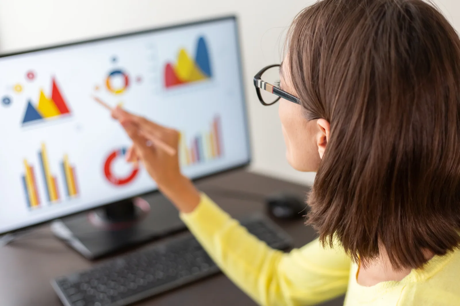 Administrator reviewing booking policies and date-range limits on a laptop dashboard.