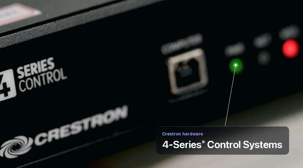 Close-up of a Crestron 4-Series control system chassis with status LEDs