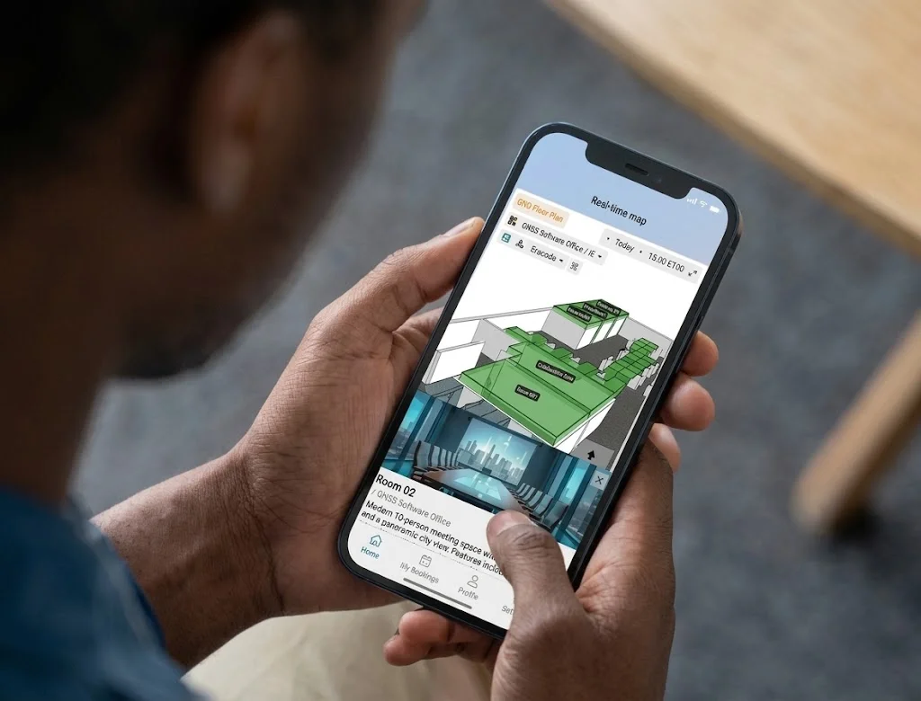 A person uses the Offision mobile app live floor plan to view and book Room 02.
