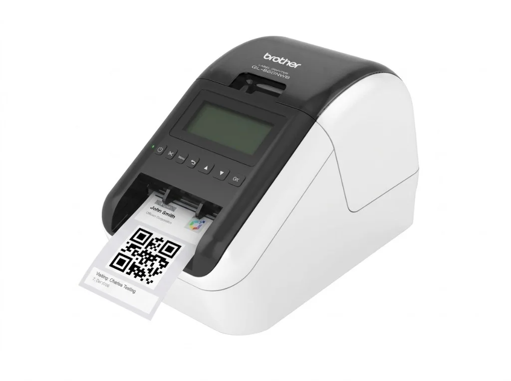 Brother QL-820NWB label printer with a visitor badge printing from the slot, showing guest name, company, host, and QR code.